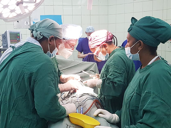 The team comprising of visiting and local surgeons performing a kidney operation for a child. Photo, MHMS.