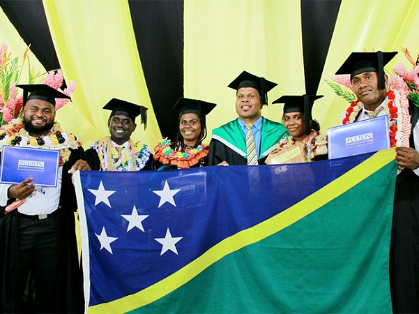 The 5 Solomon Islands Students being congratulated by the Staff Advisor. From L-R, Robinson Ray (Business IS), Jonathan Galo (Theology), Shania Ragoso (Education –Primary), Casper Hillary (Staff Advisor), LyndellaBuka (Business-Acc/Management), Nelson Francis (Theology). Photo supplied.