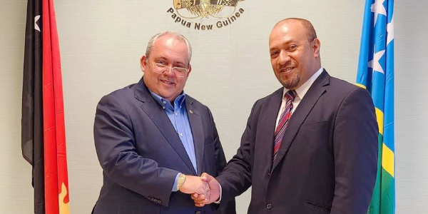 Minister for Foreign Affairs of Papua New Guinea, Hon. Justin Tkatchenko (L) and H.E. William Soaki.