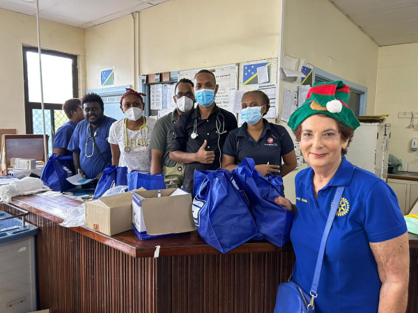 Rotary Publicity Officer Keithie Saunders handing over gift bags to the doctors and nurses at the NRH on Christmas morning.