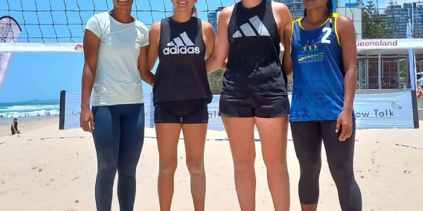 Two of our Volleyball girls with their Australian counterparts.