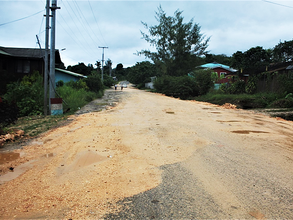 Potholes resurfacing on the road just days after it was fixed. Picture by Wilson Saeni