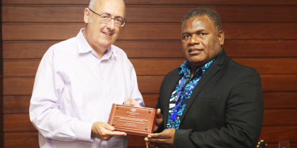 Commemorative plaque presented by Dr Lachlan Strahan, Australian High Commissioner to Solomon Islands to Mr Jimmy Sendersley after the handover ceremony
