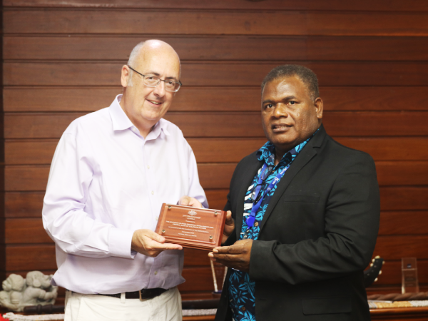 Commemorative plaque presented by Dr Lachlan Strahan, Australian High Commissioner to Solomon Islands to Mr Jimmy Sendersley after the handover ceremony