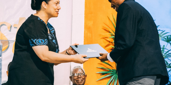 Pr Jason Gulea receives his certificate from Trans Pacific Union General Secretary Ms Jane Gibson-Opetaia. Photo supplied.