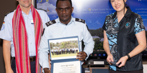 Sergeant Mcnicol with the trainers during the certificate presentation.