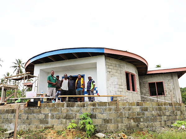 (L-R) Director Governance Hickson George, CDO Lemech Tovavaki, Director RDD Milfred Delemani and a contractor rep. Looks on from behind is one of the contractor rep and Constituency Project Officer Linzly Zapo in front of the new Police Post funded by CDF. Construction on the project now into its finishing stage.