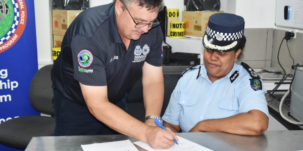 AFP RAPPP member, Assistant Superintendent Paul Ryan, presents RSIPF Assistant Commissioner, Patricia Leta, with consumables and equipment to support the Forensic Capabilities of the RSIPF. Photo, RSIPF Media.