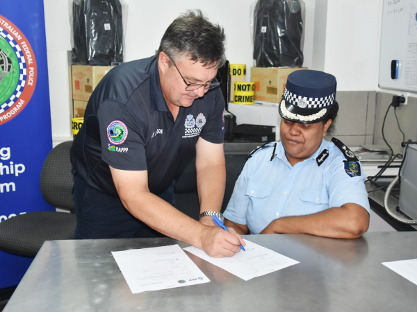 AFP RAPPP member, Assistant Superintendent Paul Ryan, presents RSIPF Assistant Commissioner, Patricia Leta, with consumables and equipment to support the Forensic Capabilities of the RSIPF. Photo, RSIPF Media.