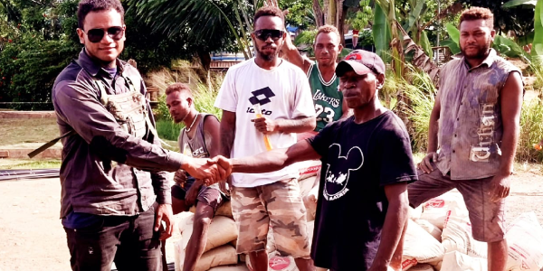 Community Leader representative receiving Materials on behalf of community leaders from CDO Ronia and CHC staff.