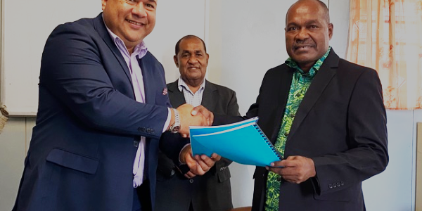 MMG’s Richard Broadbridge (left) with SIBC Chairman William Parairato after the contract signing on Tuesday. In the centre looking on is SIBC’s Chief Executive Officer, John Honimae.
