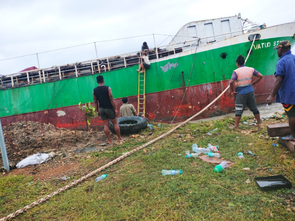 MV Vatud Star crew members prepare to refloat the vessel, Thursday.