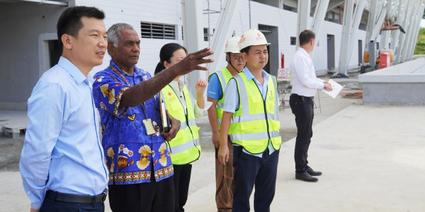 Secretary to Prime Minister and Chairman of the Pacific Games 2023 National Hosting Authourity, Dr Jimmy Rodgers and China Civil Engineering Construction Company (CCECC) CCECC Team leader, Huang Peng, with CCECC staff having a brief view of the national stadium project yesterday. Photo by CHARLES KADAMANA.