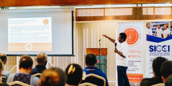 An officer of the SIEC doing a presentation on the elections to members of SICCI last Friday. Photo, SIEC FB Page.