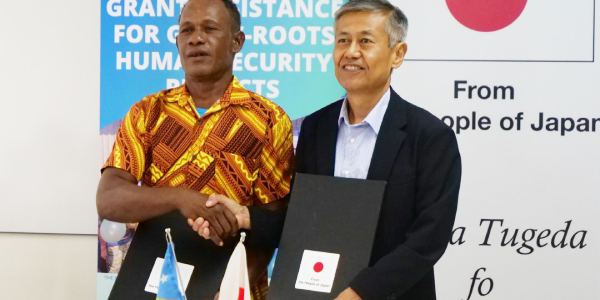 The Falake community representative, left, and the Japanese Ambassador, Miwa Yoshiaki, at the grant signing ceremony.