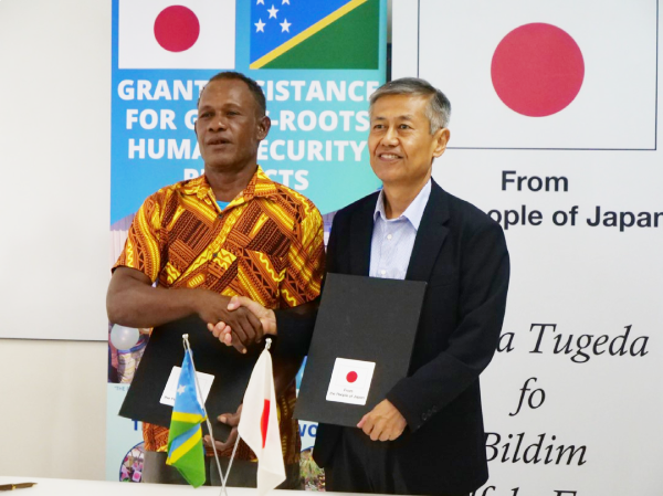 The Falake community representative, left, and the Japanese Ambassador, Miwa Yoshiaki, at the grant signing ceremony.