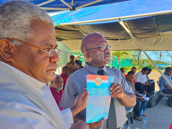 Give me wisdom to govern your people, was the prayer offered in dedicating the Policy Document. Fr Anderson Saefo’oa and Premier Finihold up the Policy Document after it was dedicated.