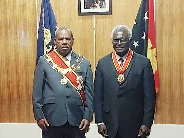 Prime Minister Manasseh Sogavare and the PNG Governor General Sir Bob Dadae after receiving the award.