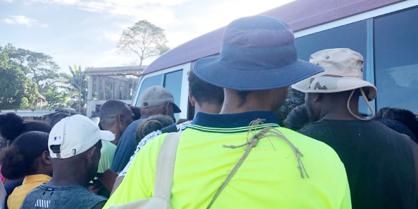 A busy day at the Lunnga Bus Stop: People rushing onto a Honiara-bound public transport bus to secure a seat. Photo Lachlan Eddie Hoe.