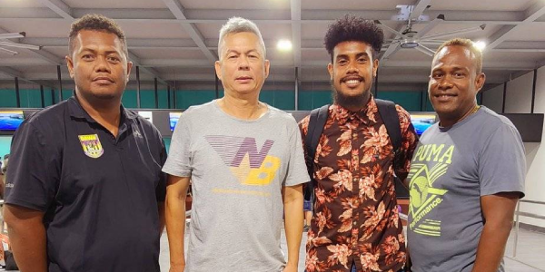 Calvin farewelled by Dawn FC coach Arthur Bako, SIFF president William Lai and Super Futsal League coordinator Jason Oihanua.
