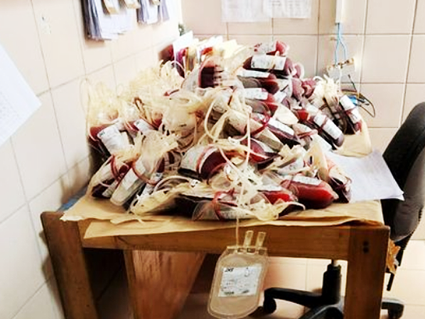 Damaged bags of blood left lying on a table and a box in the Blood Bank Centre. Photo, YTTF.