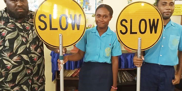 Florence Young Christian School students with the ‘Slow’ signages.