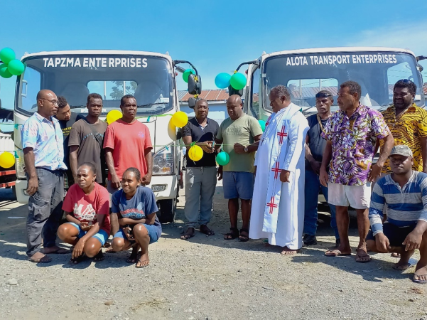MP Veke and the Ministry of Rural Development Deputy Secretary Technical Hugo Hebala cuts the ribbon to officially hand over the vehicles to recipients