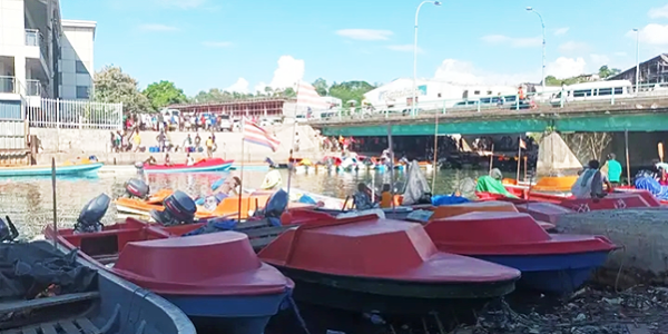Fibreglass boats berthing along the Matanikau river banks below the Matanikau bridge.