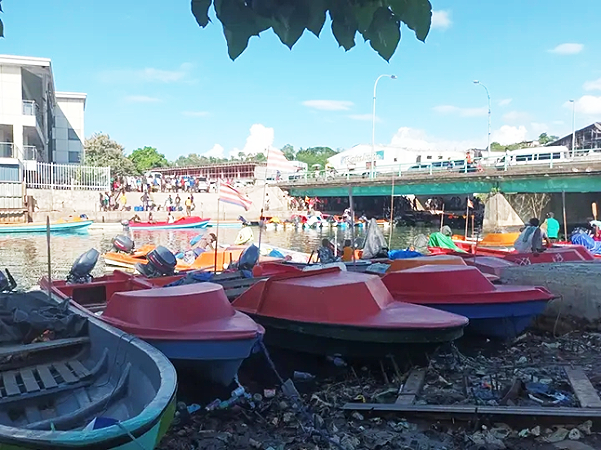 Fibreglass boats berthing along the Matanikau river banks below the Matanikau bridge.