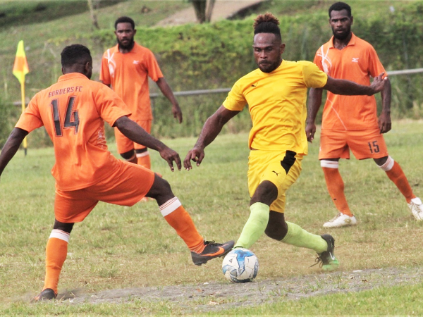 Southsiders player in yellow heavily marked by AG Fiu FC players in orange. Picture by Wilson Saeni.