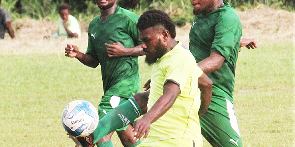 Wale’s player in green clears the ball away from GB FC player. Picture by Wilson Saeni.