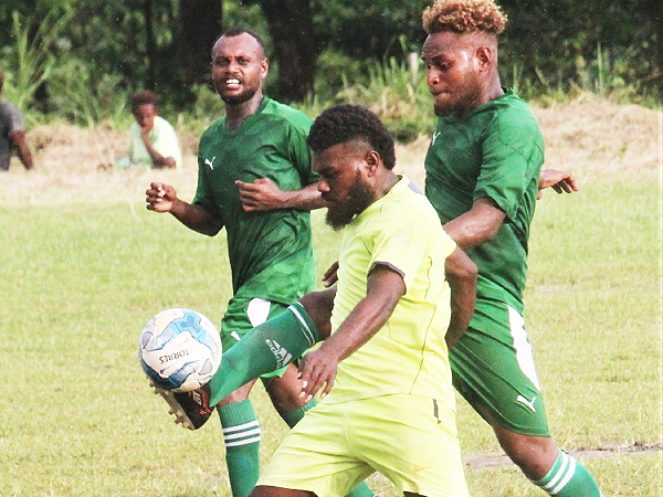 Wale’s player in green clears the ball away from GB FC player. Picture by Wilson Saeni.