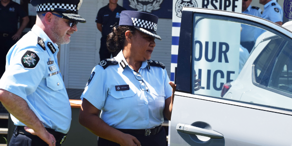 Deputy Commissioner Operation Ms Juanita Matanga and AFP Assistant Commissioner Asia Pacific Command Mr Nigel Ryan checking out the new vehicles.