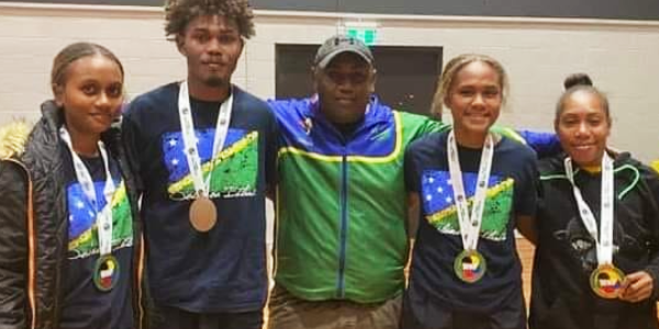Karate Coach Ronnie Uate’e and medal winners