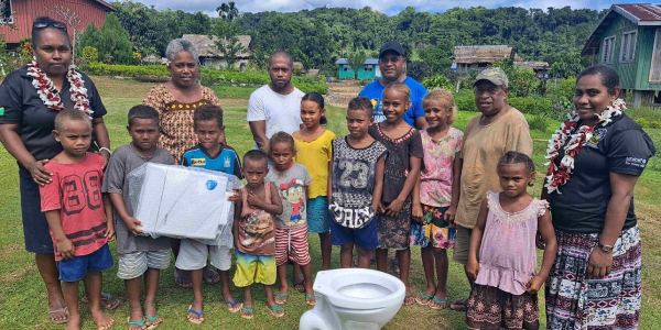 Laugwata community members and officers from Malaita Provincial Health Authority posing with the new toilet system during the handing over ceremony. Photo by Solomon Lofana.