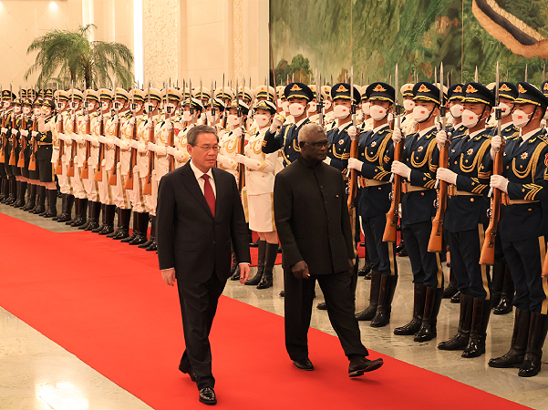 PM Sogavare inspecting guards of honour during the welcome ceremony. Photo supplied.