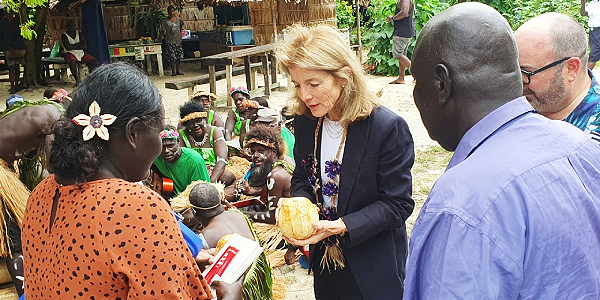 Ambassador Caroline Kennedy served a young coconut drink as she visits the Western Province to commemorate the rescue of her father during WWII. Photo, Ulutah Gina.