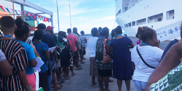Members of the public, queuing up to see the doctors onboard the Ark Peace hospital ship.