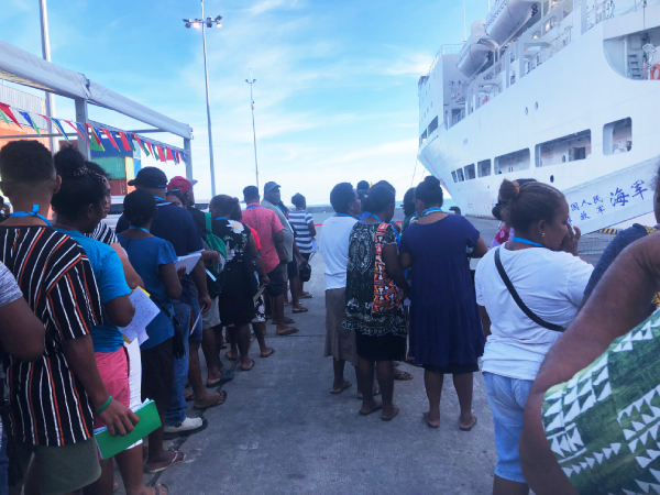 Members of the public, queuing up to see the doctors onboard the Ark Peace hospital ship.