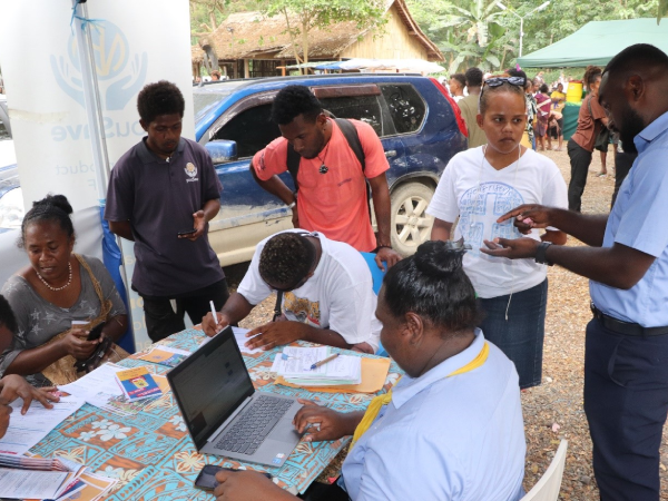 The youSave team registering new youSave members during the Malaita Day celebration in Honiara. Photo, SINPF.