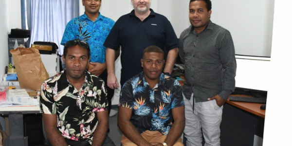 AFP Digital Forensics expert Chris Andrews, standing in the middle, with 2IC Forensic Services (Supervising) standing left and RSIPF Digital Forensics Operators (1)