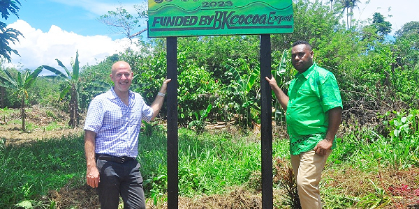 Director of Holland Commodities International Chris Pople (left) with Blaise Kokou at the Bonege & Vura Cocoa Rehabilitation project site. Photo by Lachlan Eddie Hoe.