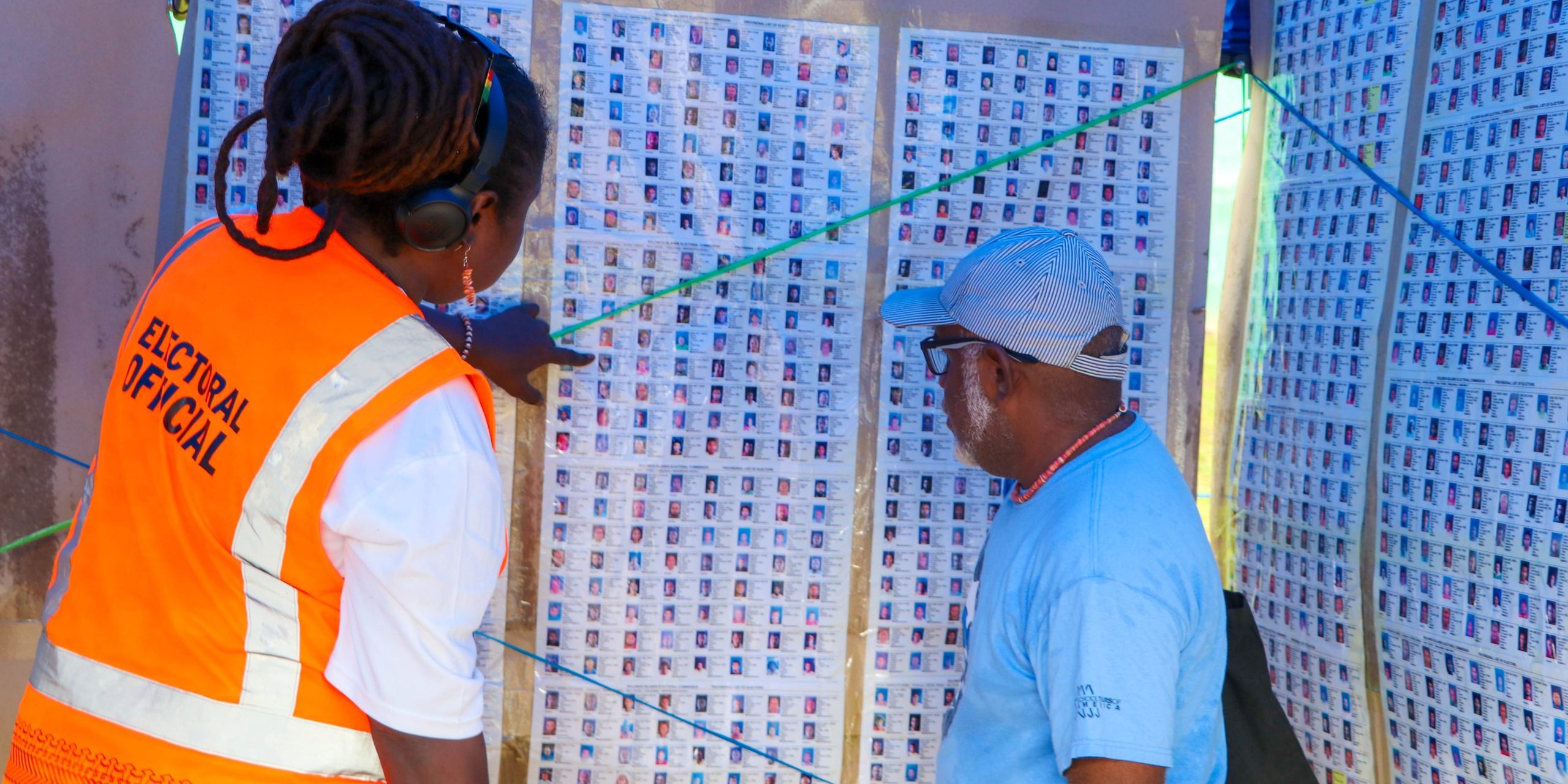 Central Honiara Election Official assisted a voter to check his name on the Provisional Voter List. Photo, MRD.