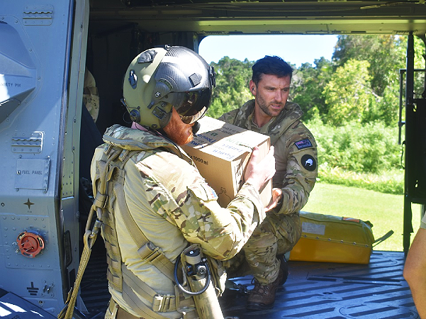 RNZAF officers assist to unload the medical supplies to Buala hospital. Photo supplied.