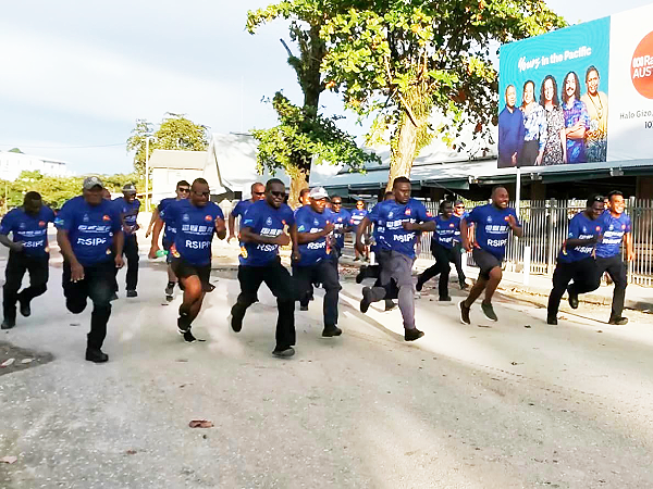 Officers in the 100m sprint race.