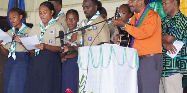 Solomon Islands Scout singing a peace dialogue promotion song.