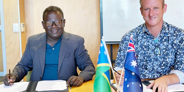 Australian High Commissioner His Excellency Rod Hilton and Permanent Secretary for the Ministry of Finance and Treasury McKinnie Dentana sign the financial arrangement.
