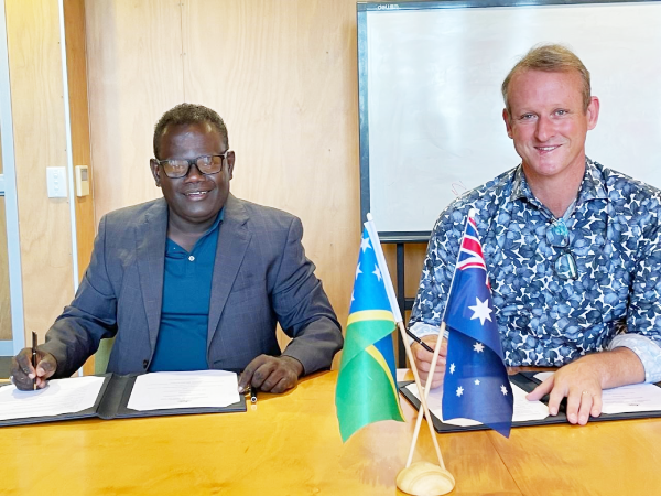 Australian High Commissioner His Excellency Rod Hilton and Permanent Secretary for the Ministry of Finance and Treasury McKinnie Dentana sign the financial arrangement.