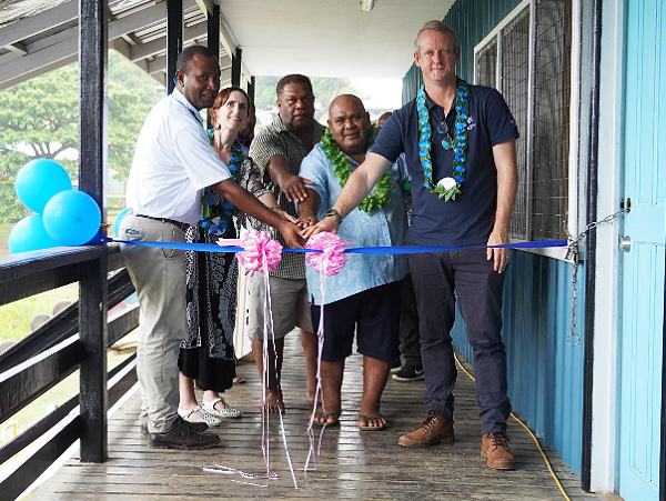 Australian High Commissioner Hilton, School Principal Ngidua, MEHRD Deputy Secretary Corporate Services Mr Kolae, Deputy New Zealand High Commissioner Williams cutting the ribbon to mark the opening of the new classroom building.