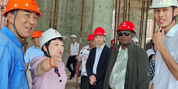 Ms Zheng explains the ongoing construction work.